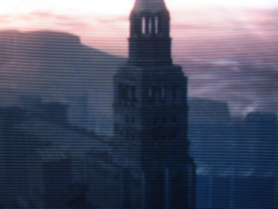 Having scaled Sen's Fortress you look back on the bell tower of the Undead Parish cutting through the mist and stabbing at the lonely sky.