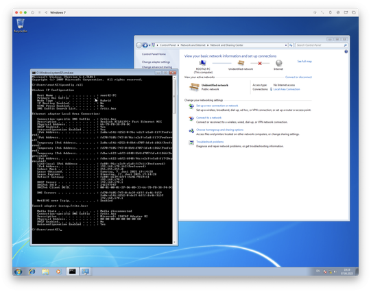 A Windows 7 virtual machine showing a CMD console with the output if ipconfig, stating my IP address on the home network and the router address.