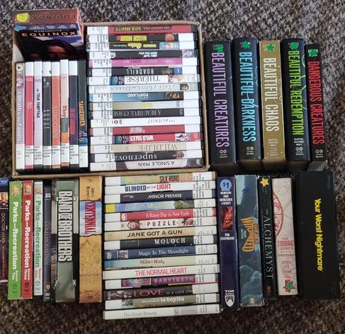 Two TV miniseries, three seasons of Parks &Rec, a Doctor who story, 41 DVD movies, a VHS movie, the entire Beautiful Creatures book series, two trade paperbacks, and two hardcover sff books, plus the game Your Worst Nightmare. All for under $15.