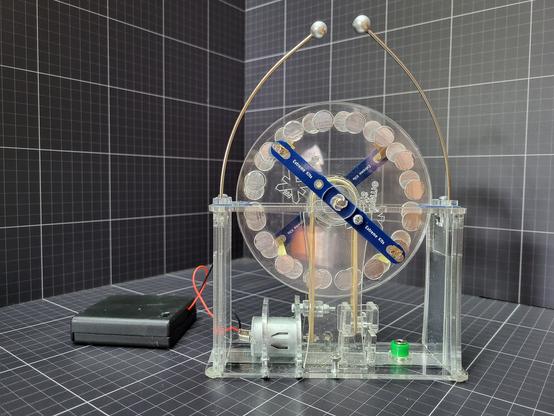 The Mini Wimshurst Electrostatic Generator kit is designed for older kids (or adults) to learn about “static” electricity by actually building a working Wimshurst generator. A small Wimshurst Electrostatic Generator that will achieve up to 60,000 volts of “static” electricity. The Mini Wimshurst Electrostatic Generator kit is a complete Wimshurst system, comprising of a high speed motor driving two rotating disks, two PCB neutraliser bars with 4 brush contacts, two high voltage capacitors, two discharge balls and rods and two PCB charge collectors. Supplied with a switched battery box for 4 AA cells.