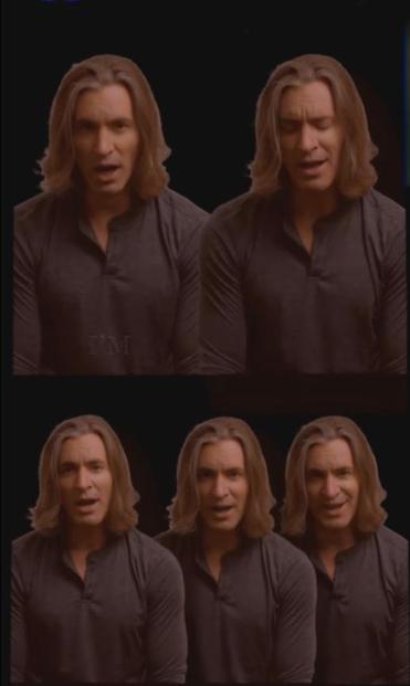 Geoff Castellucci, an attractive man with long light brown hair, singing his cover of the song Warfaring Stranger accompanied by his four digital clones.