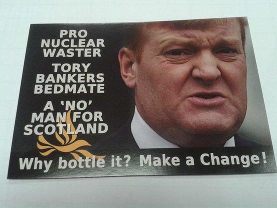 The image features an election leaflet from the SNP with a black background and white text. On the left side, there is a photograph of  Charles Kennedy's face, partially visible, wearing a dark suit and a white shirt. The text on the poster includes the following phrases: "PRO NUCLEAR WASTER," "TORY BANKERS BEDMATE," "A 'NO' MAN FOR SCOTLAND," and "Why bottle it? Make a Change!" Below the text, there is  LibDem  logo  in gold color. The overall layout is simple, with the text arranged in a vertical column on the left side of the image. 

Provided by @altbot, edited by @jemmesedi