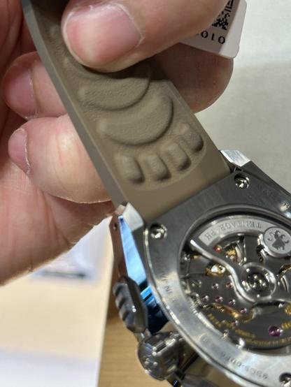 A close look at the lion paw motif on the back of the rubber straps.