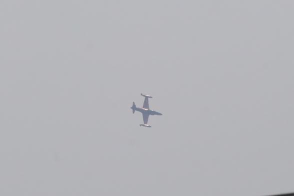 T33 Red Knight jet plane banking.