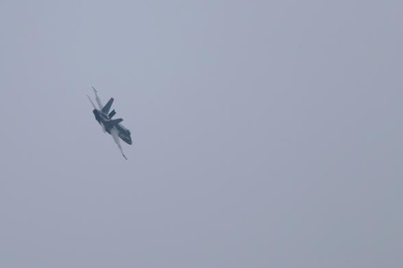 F18 Hornet with airbrake deployed in a steep turn