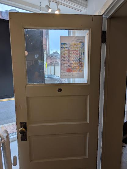 Doors and the poster for the exhibition