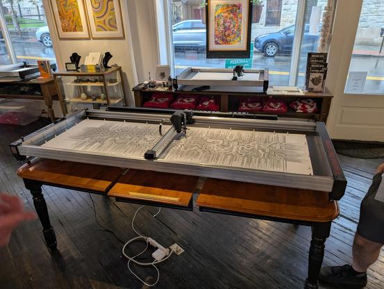 Very large plotter plotting a tall drawing