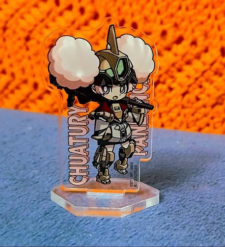 A mini acrylic standee of Chuchu from The Witch from Mercury in Gundam cosplay