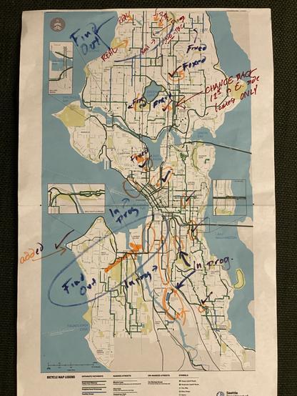 Seattle 2025 bike map printed at 11x17 and scrawled all over with several different colours of marker