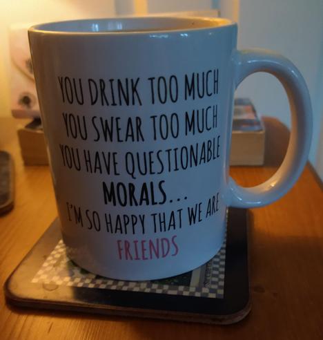 Mug of tea on a bedside cabinet