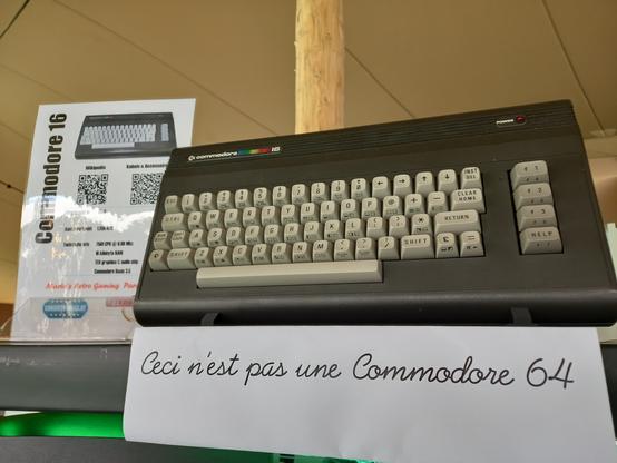 Commodore 16 with an info sheet indicating that it is not a Commodore 64.