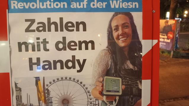 Zeitungsschlagzeile: Revolution auf der Wiesn - Zahlen mit dem Handy