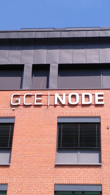 "GCE|NODE" logo on an office building