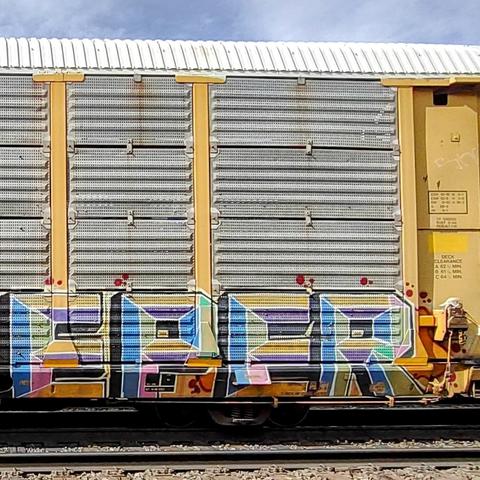 Train car with graffiti rolling through Kamloops BC Canada