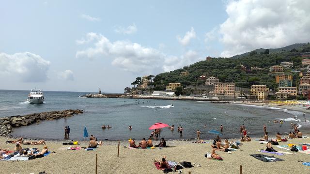 Another surfer smoothly riding a relaxed mediterranean wave at Recco.
