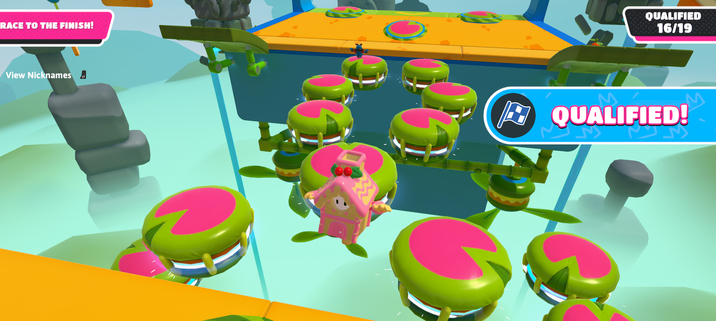 A screenshot taken during the qualified section of a Lily Leapers game, with one player wearing the outfit of a pink gingerbread house.
