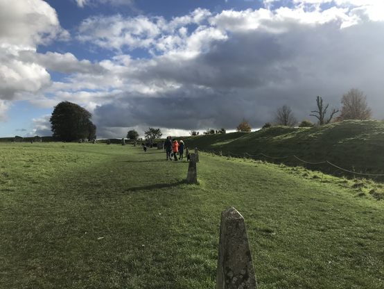 Long shot of line of standing stones at Avebury.