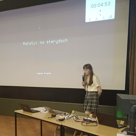 Me giving a lightning talk titled „Ratatui na sterydach” (Ratatui on steroids)
