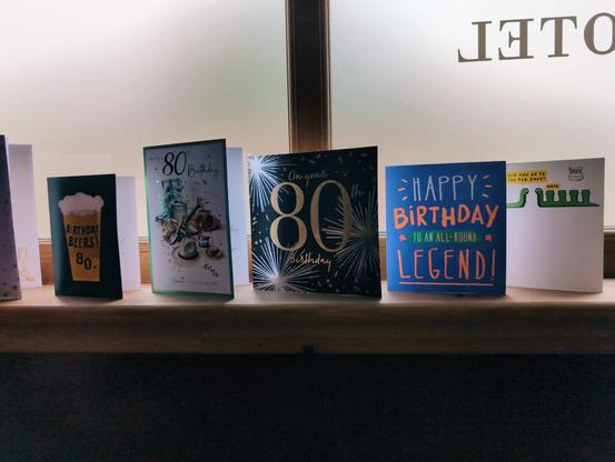 Birthday cards in a row on a shelf