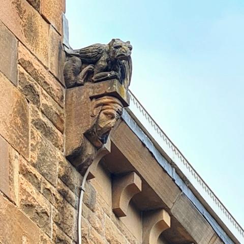 A griffin-like grotesque on a corbel of a Victorian church in Glasgow.