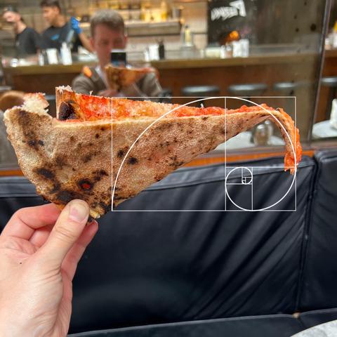 A “pinch” folded pizza slice with the golden ratio applied to the drooping tip