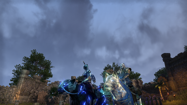 A white-haired and black-furred female khajiit with glowing blue markings riding a dro-m'athra senche, alongside a white-furred male khajiit in blue and gold riding a glowing wolf of light, in the middle of some Argonian ruins