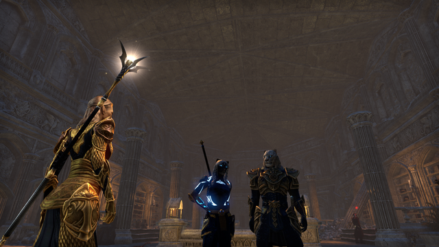 A white-haired and black-furred female khajiit with glowing blue markings stands next to a white furred male khajiit in gold and blue armor within a ruined temple to Meridia. A priest of hers stands before them.