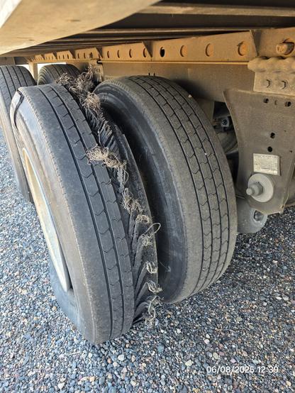 Picture of a blown-out tractor trailer tire