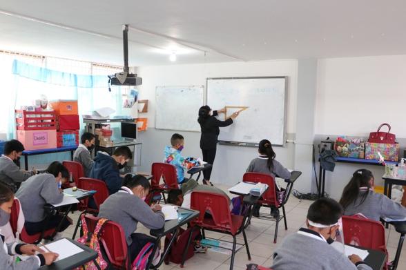 Alumnos en salón de clase