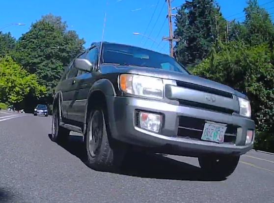 rear view from bike, driver with an empty lane on his left
