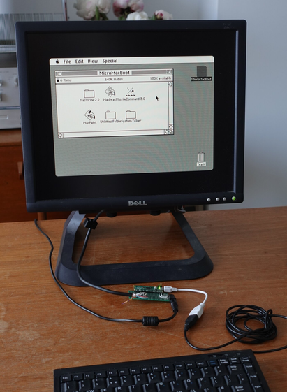 "A Raspberry Pi RP2040 microcontroller (on a Pico board), driving monochrome VGA video and taking USB keyboard/mouse input, emulating a Macintosh 128K computer and disc storage."