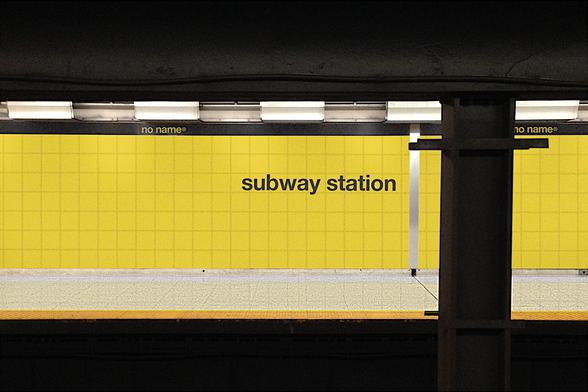 View of TTC platform in Loblaws noname brand livery.

The tiles are yellow; in place of the station name are the words "subway station" in Helvetica.