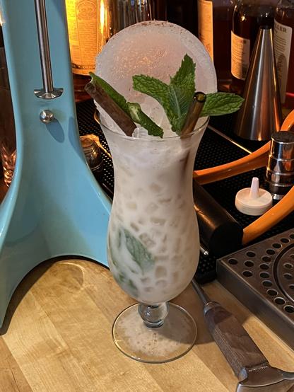 Manta Ray cocktail by Garret Richard from the Total Tiki app.
Hurricane glass, ice shell, cinnamon stick, lime twist, and mint garnish.