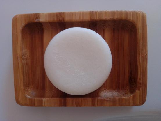 Owl & Bee® Shampoo Bar on a bamboo tray
