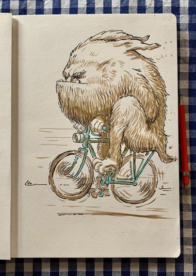 A whimsical illustration of a furry creature riding a bicycle. The creature has a large, fluffy body and an expressive face, depicted in brown ink with teal accents on the bicycle.