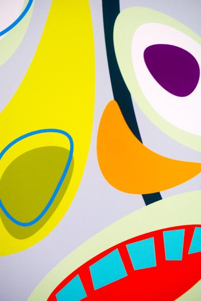 Detail of fine art print Mickey. Part of abstracted shapes in bold colors, eye, nose, mouth.