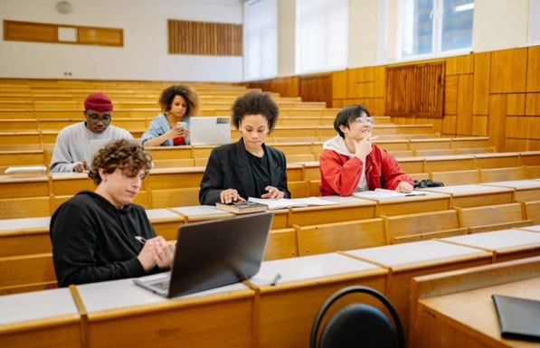 Image of University lecture hall with five students sitting. by Jan Krakau via Pexels.