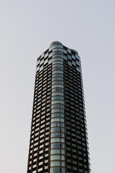 photo of a single skyscraper reaching into the sky