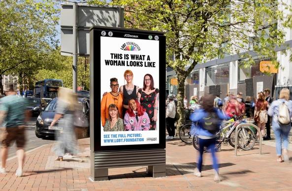 Image of a diverse group of women on a pavement advertising display