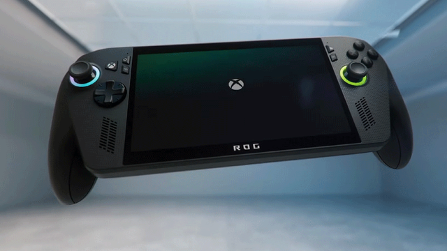 The image features a handheld gaming console with a sleek, modern design. The console is predominantly black with accents of blue and green on the joysticks, which are located on the left and right sides. The screen is centered and displays the Xbox logo, indicating the console's brand. The word "ROG" is visible at the bottom of the screen, suggesting a collaboration or special edition. The console has a rectangular shape with rounded edges and includes various buttons and controls, such as a directional pad, action buttons, and a trigger button. The background is a simple, light-colored corridor, emphasizing the console's design.

Provided by @altbot, generated privately and locally using Ovis2-8B

🌱 Energy used: 0.140 Wh