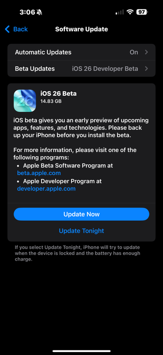 The image shows a smartphone screen displaying the "Software Update" settings. At the top, the time is 3:06, the battery is at 97%, and the signal strength is full. The screen is predominantly black with white and blue text. The "Software Update" section is highlighted, with "Automatic Updates" turned on and "Beta Updates" set to "iOS 26 Developer Beta." Below this, there is a detailed description of the "iOS 26 Beta" update, which is 14.83 GB in size. The update is described as providing an early preview of upcoming apps, features, and technologies, and users are advised to back up their iPhone before installing the beta. Links to the Apple Beta Software Program and the Apple Developer Program are provided for more information. Two buttons are visible: "Update Now" and "Update Tonight," with the latter suggesting the update will occur when the device is locked and the battery has enough charge.