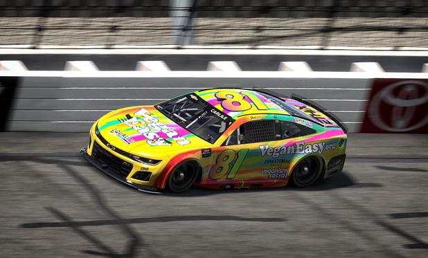 Simulated NASCAR stock car on track. Vibrant rainbow colors. VeganEasy.org the primary sponsor. Number 81.