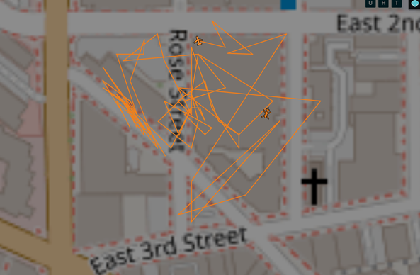 Map of downtown LA with the path of a plane darting all around over Rose Street above buildings