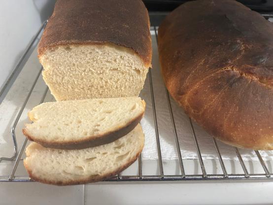 A photo of the same bread as above, but this time with the end cut off the sandwich loaf, showing the fluffy white inside.