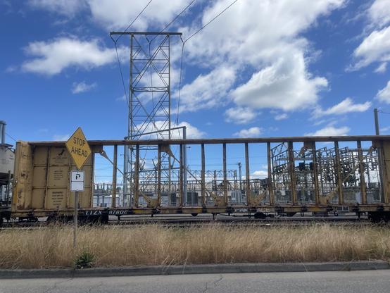 Framework of a train car with sky behind