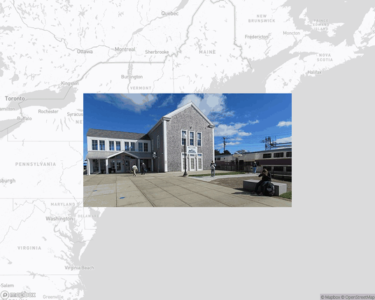A photo of or from a train station from the linked website, overlaid on a cropped world map where it's located.