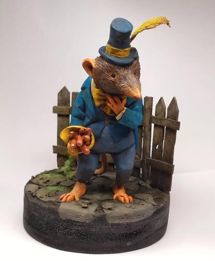 Clay sculpture of a shrew with a worm bouquet by Victoria Maderna.