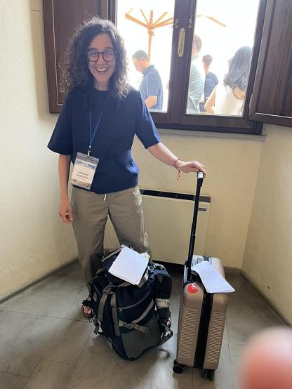 Arianna is bringing the lost two pieces of luggage being delivered from the airport.