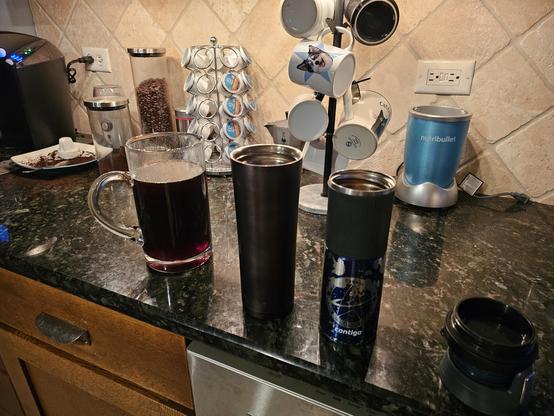 A 4 cup carafe and two travel mugs.  One nondescript black, the other a contigo with the star trek logo on it.