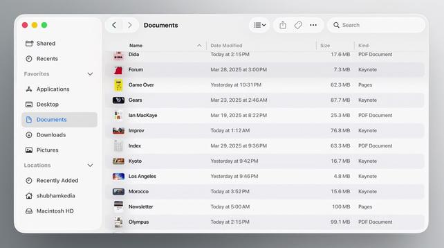 Screenshot of a macOS 26 Finder window. Its UI elements are drawn as if made of glass, standing out far more than the file list or even the window title.